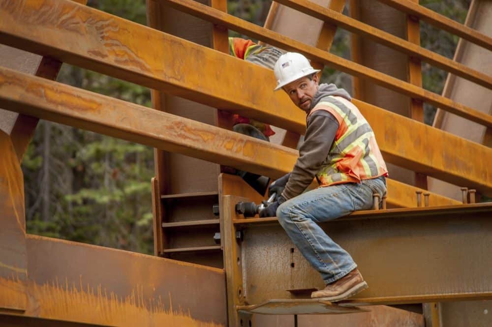 Construction Worker On A Beam Stock Photo