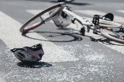 Bicycle laying in street after accident