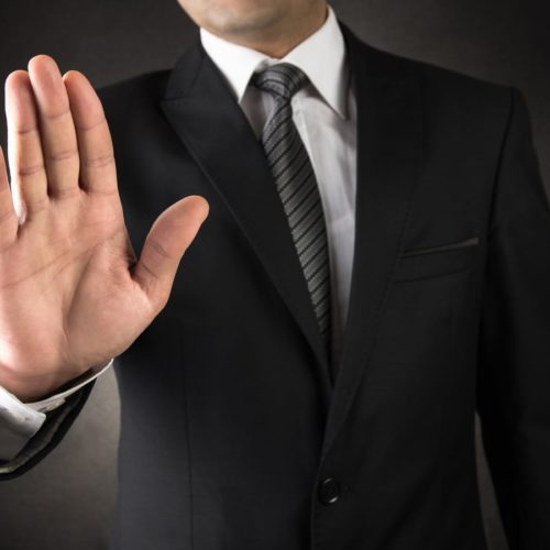 Man showing stop sign stock photo