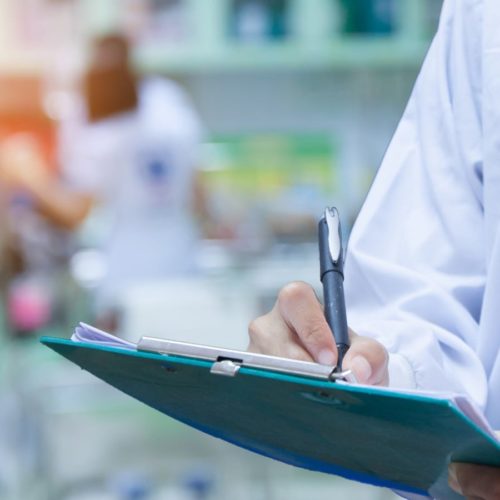 Doctor Writing Prescription Stock Photo