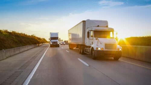 18-Wheeler Trucks Driving On The Interstate
