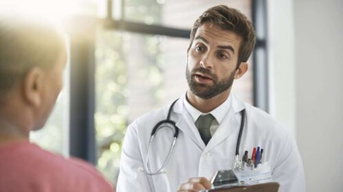 Doctor Talking With Patient Stock Photo
