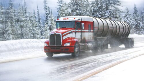 18-wheeler Truck Driving In The Snow