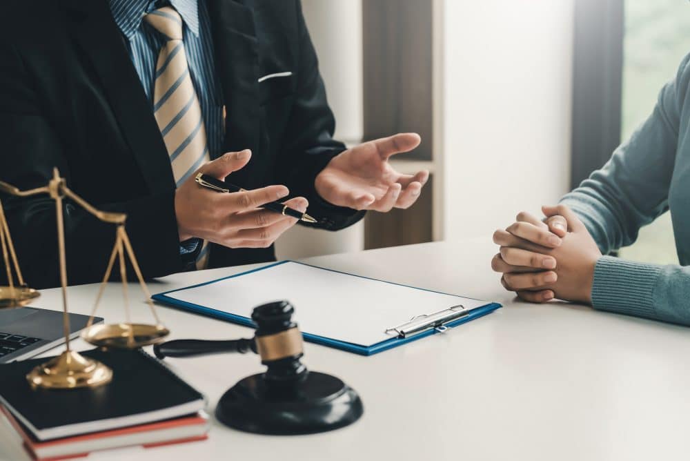 A client discusses their legal options with a PFAS contamination lawyer in Boston.
