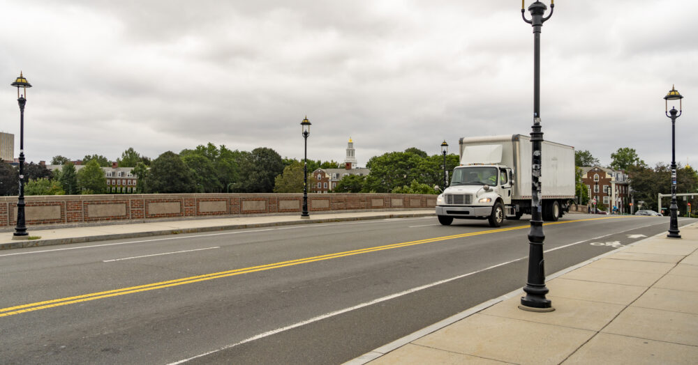 A big truck travels down the streets of Boston.